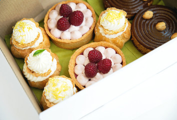 Fresh desserts in the paper delivery box. Close up shot of fresh dessert for delivery. - 118757928