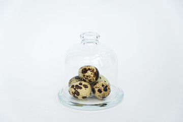 Raw Quail eggs on a glass dome. Healthy minimalistic background. Conceptual minimalistic food.Raw healthy food. - 118757976