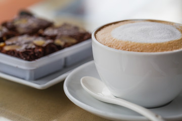 A coffee cup and bean.