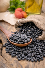 Black beans in a wooden