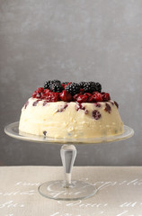 Cheesecake with cherries, blackberries and blueberries.