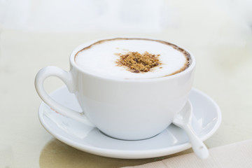 A  hot coffee in cup.