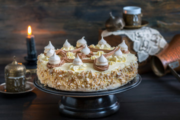 Meringue cake with peanuts and cream,