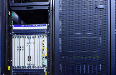 room with rows of server hardware in the data center