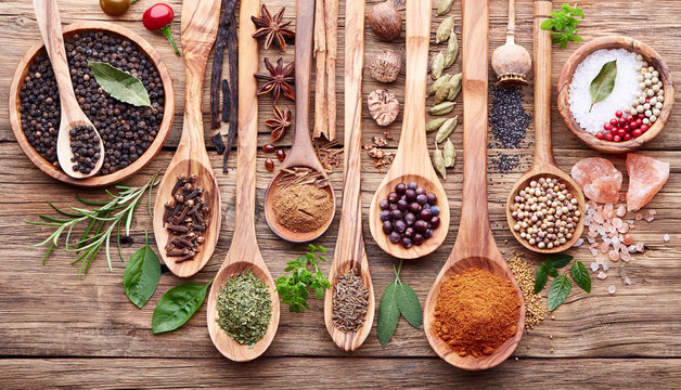 Herbs with spices on a wooden board