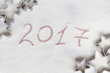 Cookies cutters on a flour white background. Bakery concept. Chr