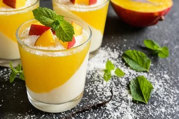 Gordijnen Coconut panna cotta dessert with mango jelly in a glass jar © noirchocolate