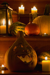 Halloween pumpkins with lantern on wooden staircase, lit only by candles, dark background