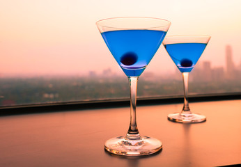 Colorful martini drink on a bar table. 
