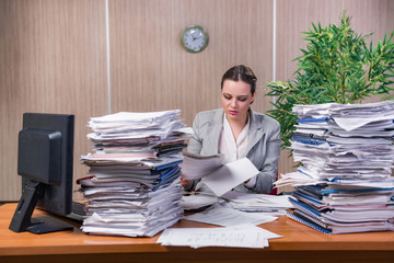 Businesswoman under stress working in the office