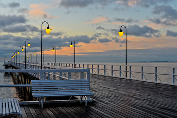 Beautiful wooden pier at sunrise