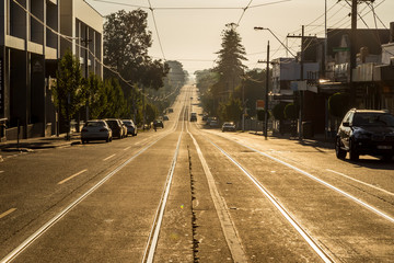 Lonely street and tram track in early morning