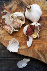 Garlic on a wooden table. Fresh  vegetables on wooden background table from above. Healthy, vegetarian, organic food  