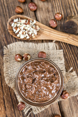 Bowl with Chocolate Cream (on wooden background)