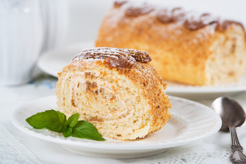 Biscuit roll with condensed milk, selective focus