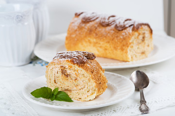 Biscuit roll with condensed milk, selective focus