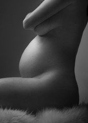 Pregnant Woman holding her hands on beautiful belly