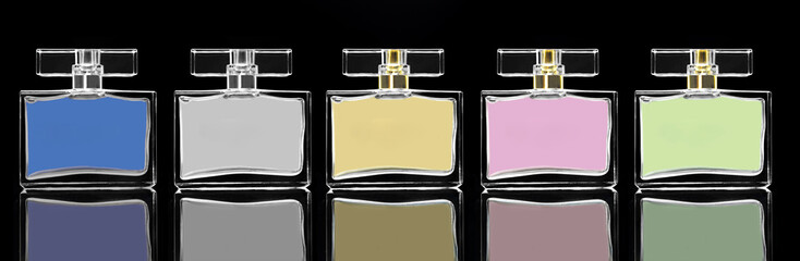 different color elegant perfume bottles in black background