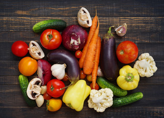 Fresh  vegetables on wooden background table from above. Healthy, vegetarian, organic food  
