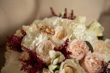 Wedding details. Luxury wedding rings on flowers