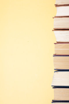 Stack of colorful books on table. Education background. Back to school. Copy space for text
