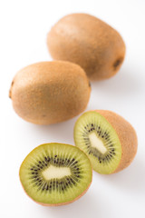 kiwi fruits, fresh cut, close up, vertical, isolated on white