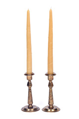 Pure beeswax candle in vintage candle holder separated on white background