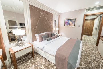 Modern hotel room with big bed