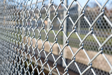 metal fence cage in a soccer field, closeup, horizontal