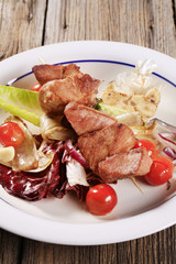 Pork kebab and vegetables