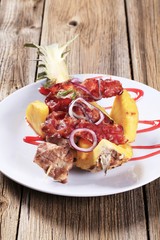 Meat skewers and crispy bacon strips
