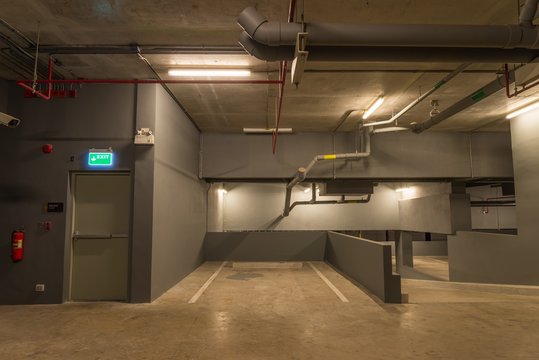 Parking garage in modern building with warm lighting 