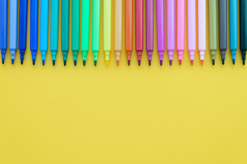 Colorful pen on yellow background with copy space - Creative idea and education concept.
