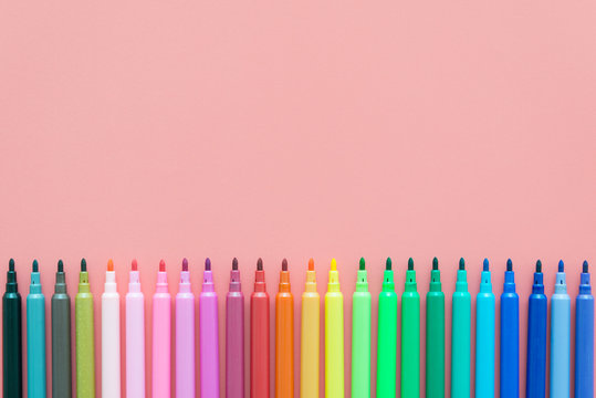 Colorful pen on pink background with copy space - Creative idea and education concept.