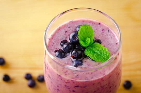 Healthy Blueberry Banana Smoothie With Mint And Fresh Berries In A Glass