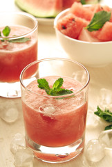 Healthy watermelon smoothie with mint and ice in glass