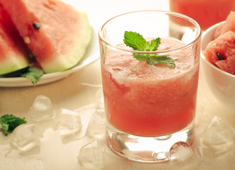 Healthy watermelon smoothie with mint and ice in glass