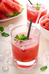 Healthy watermelon smoothie with mint and ice in glass