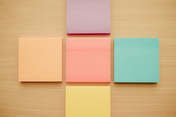 Color block of paper notes on wooden background