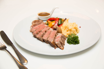 Beef steak with sauce as closeup