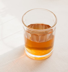 Glass of tea on blury  background
