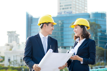 Team of engineers at the construction. Two architects discussion