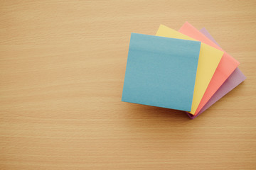 Color block of paper notes on wooden background