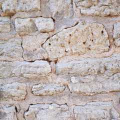 Fragment of an old brick wall