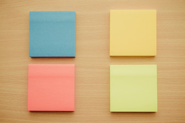 Color block of paper notes on wooden background