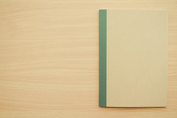 Blank empty notepad on wooden table background - Business and education concept.