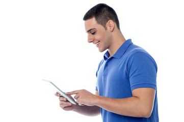 Smart guy browsing on his tablet device