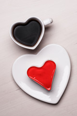 Heart shaped coffee cup and cake