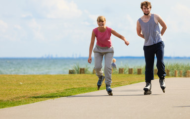 Teenagers together on skates.