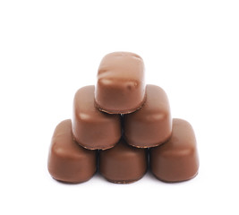 Chocolate coated toffee candy isolated